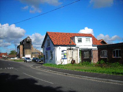 Figure 44: Quay House (right) and the Tack Shop viewed from the north end of the bridge.
