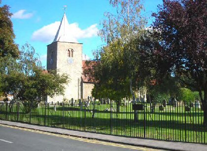 Fig. 71 Church and churchyard from New Road.