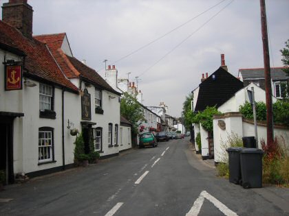 Fig. 15 The High Street looking west with The Anchor pub on the left and Vine Cottage on the right.