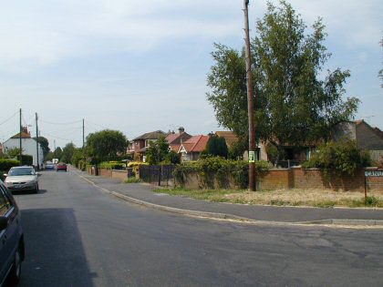 Fig. 16 High Street looking west, Canute Close in the right foreground.