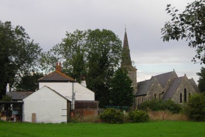 Fig. 14 View across the village green looking west, with the George and Dragon and shop to the left.
