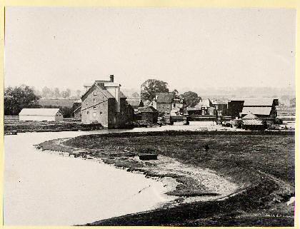 Figure 43: Battlesbridge, c.1909, showing the mill complex that previously occupied Battlesbridge Harbour. The long white building to the left remains, and the mill to the right of this burnt down in 1932.